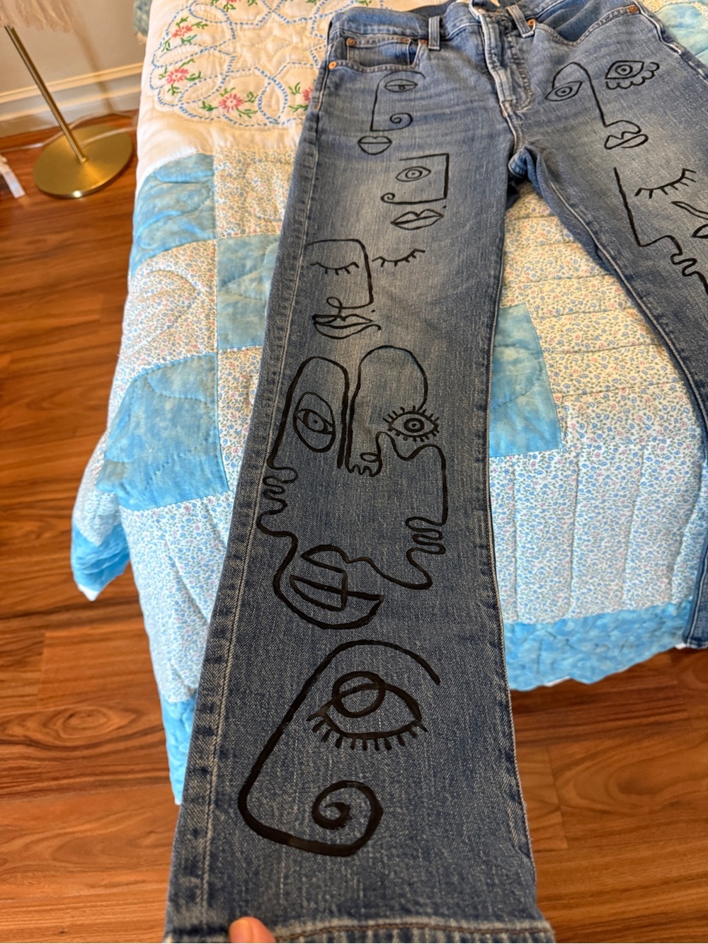 Women's Blue Skinny Jeans with Black Abstract Face Graphics
